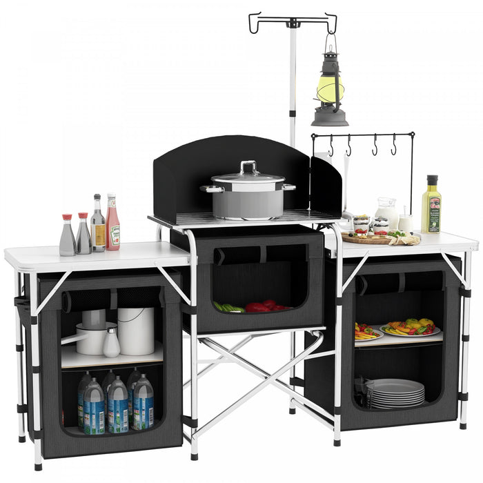 Outsunny Folding Camping Kitchen Table with Storage, Aluminum Portable Camping Table with 3 Fabric Cupboards, Windshield, Light Stand, Carrying Bag for BBQ, RV, Picnic, Black