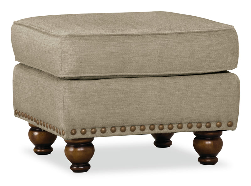 Made in Canada Wynn 24\" Chenille Fabric Ottoman with Nailhead Trim and Wood Bun Legs - Linen Beige