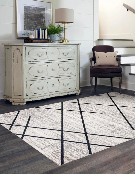 Damali Ivory/Blue Machine Washable Area Rug - 5'0\" x 7'0\"