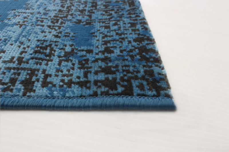 Janaki Blue 6'7\" x 9'6\" Area Rug